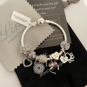 Linx Snake Chain Bracelet with 9 Linx Themed Charms 925 sterling silver